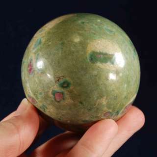 You are considering a beautiful ruby & fuchsite sphere with a hematite 