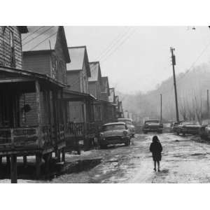 Small Girl Walking Down the Poverty Stricken Town of Hemphill in 