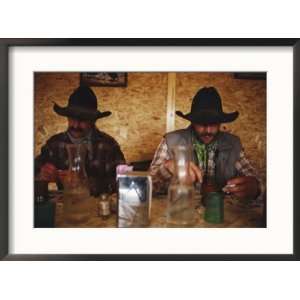 Pair of Cowboys Enjoy a Cup of Coffee at a Local Restaurant 