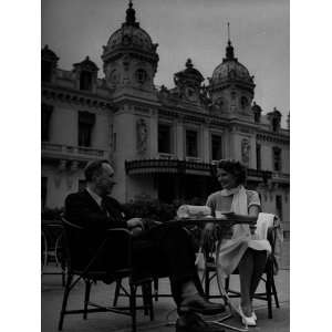 Actress Rita Hayworth Sitting and Talking to Man at Table Photographic 