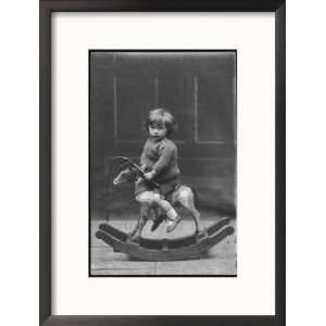 Little Boy on a Very Small Rocking Horse with a Whip in His Hand Art 