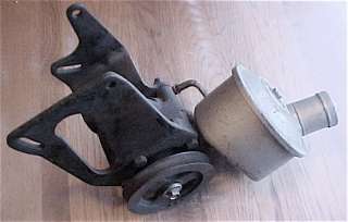  power steering pump with Nos pulley and brackets. Can has small dent 