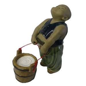   Oriental ceramic figurine   Boy pulling water bucket