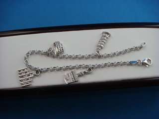   CHARM BRACELET MADE IN ITALY, WITH CHARMS, 7.5 GRAMS 7 INCHES  