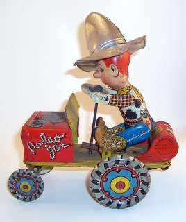 ANTIQUE WIND UP RODEO JOE TRACTOR TOY BY UNIQUE ART MANUFACTURING 