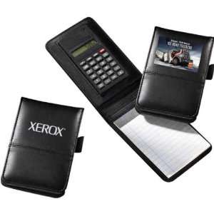   Kick   3   Note pad with calculator and pen holder.